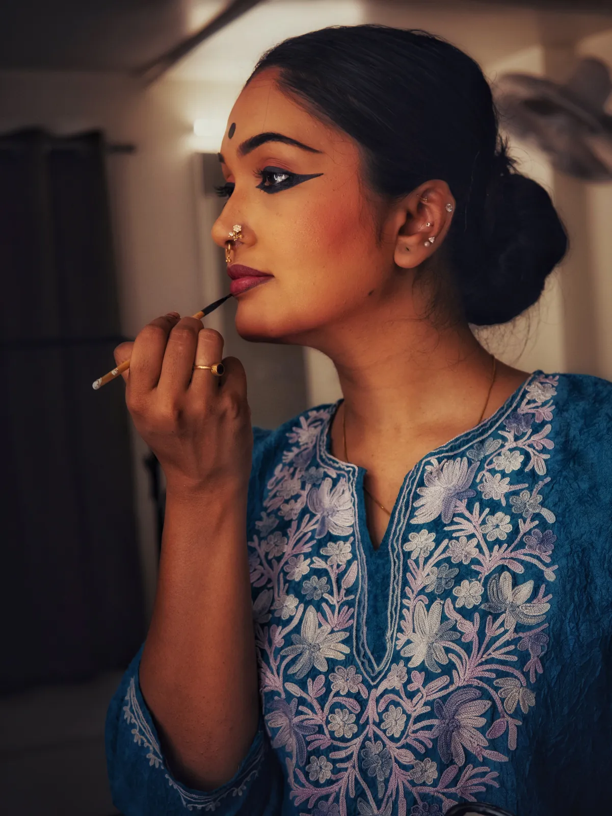 Applying make-up before a performance